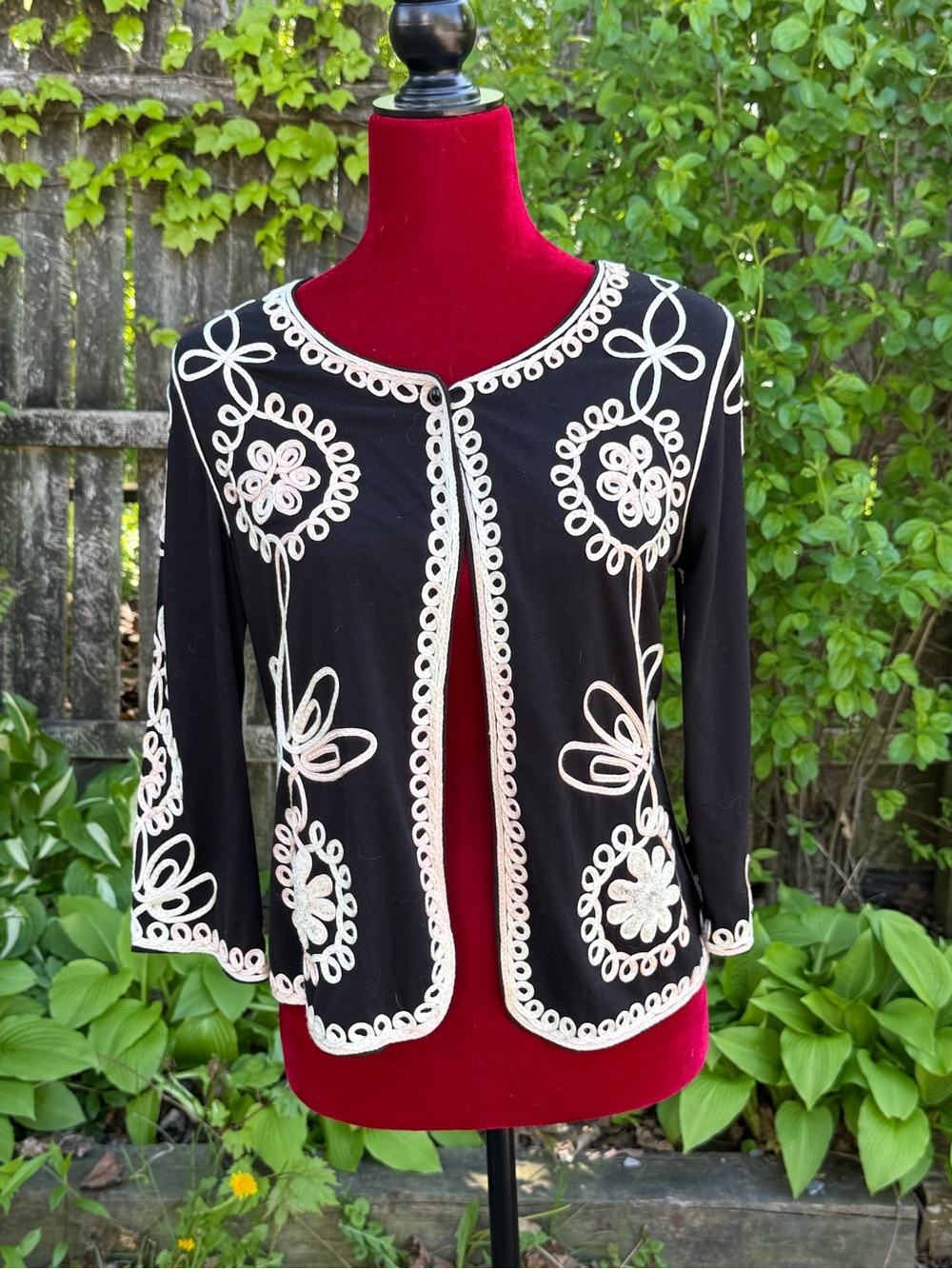 Black jacket/cardigan with white detailing
